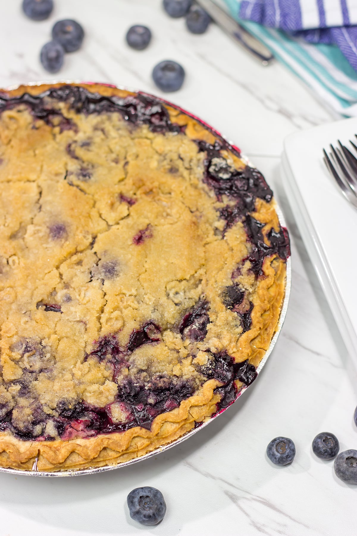 Packed with blueberries, this Blueberry Crumble Pie is a great dessert for a warm summer evening. Don't forget the scoop of ice cream on top!
