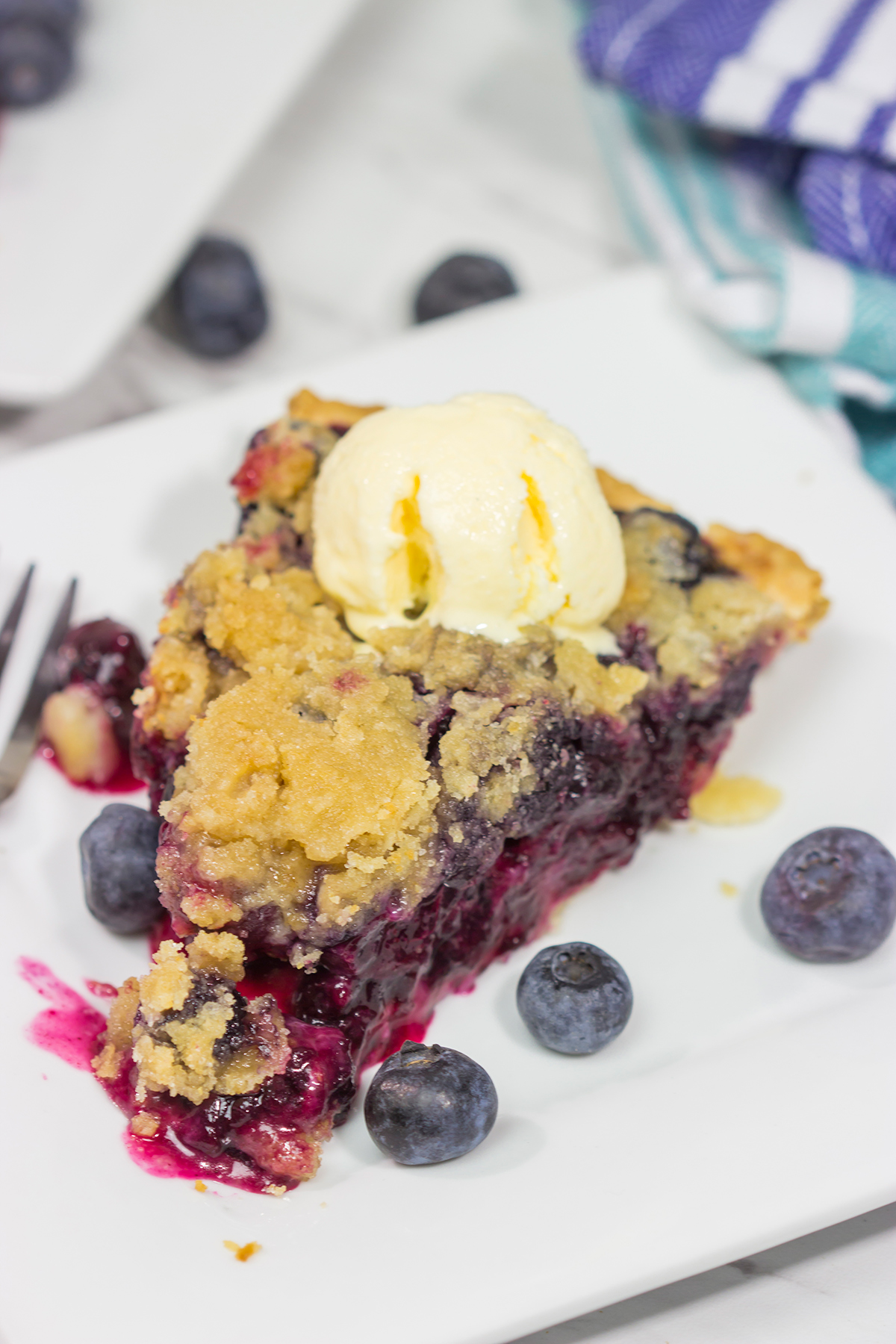 Packed with blueberries, this Blueberry Crumble Pie is a great dessert for a warm summer evening. Don't forget the scoop of ice cream on top!