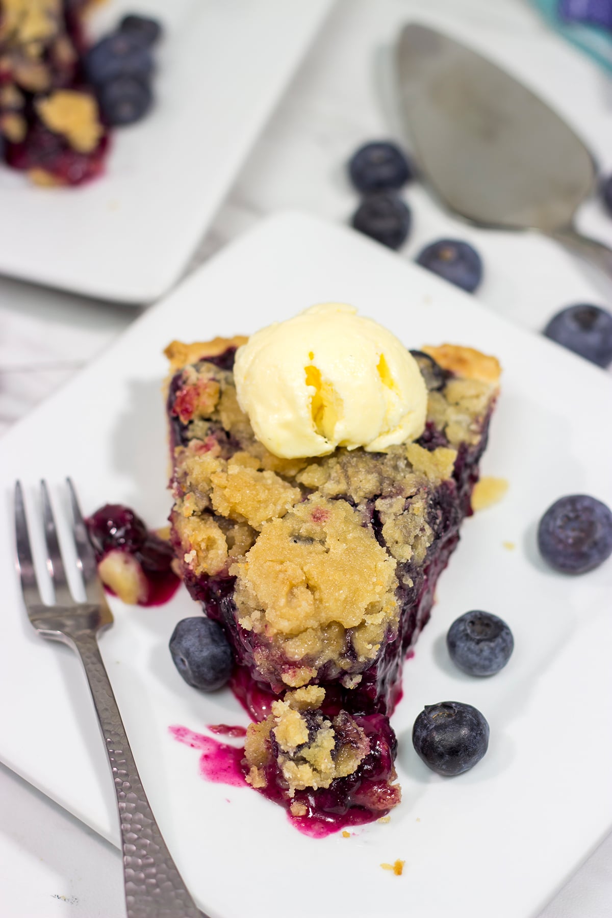 Packed with blueberries, this Blueberry Crumble Pie is a great dessert for a warm summer evening. Don't forget the scoop of ice cream on top!
