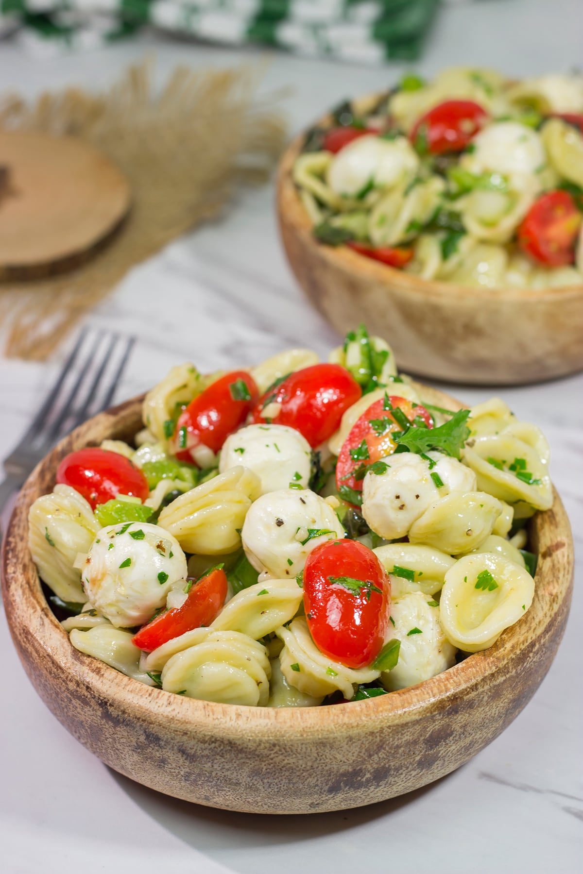 Traditional Caprese salad...in pasta salad form! This Caprese Pasta Salad is filled with fresh mozzarella, tomatoes and basil. It's a great summer side dish!