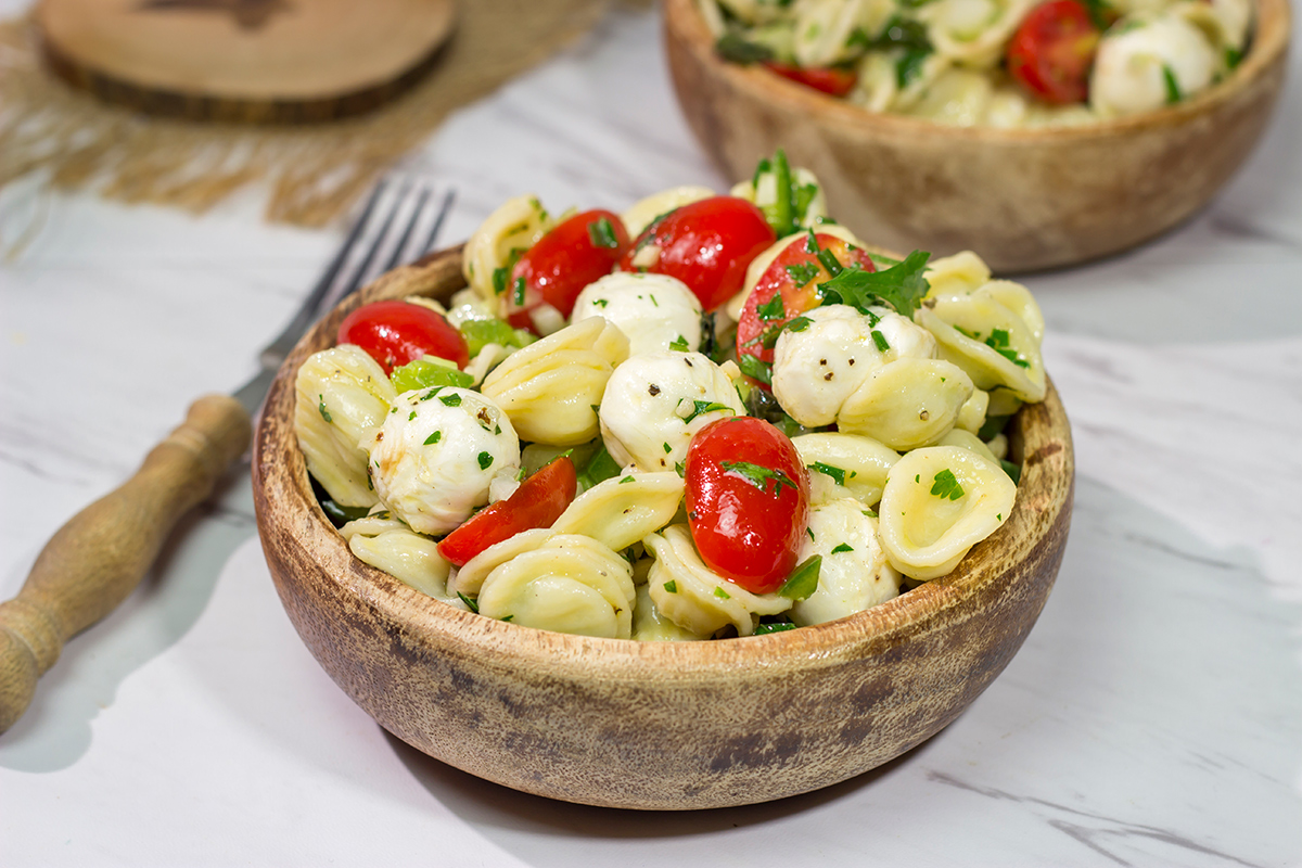 Traditional Caprese salad...in pasta salad form! This Caprese Pasta Salad is filled with fresh mozzarella, tomatoes and basil. It's a great summer side dish!