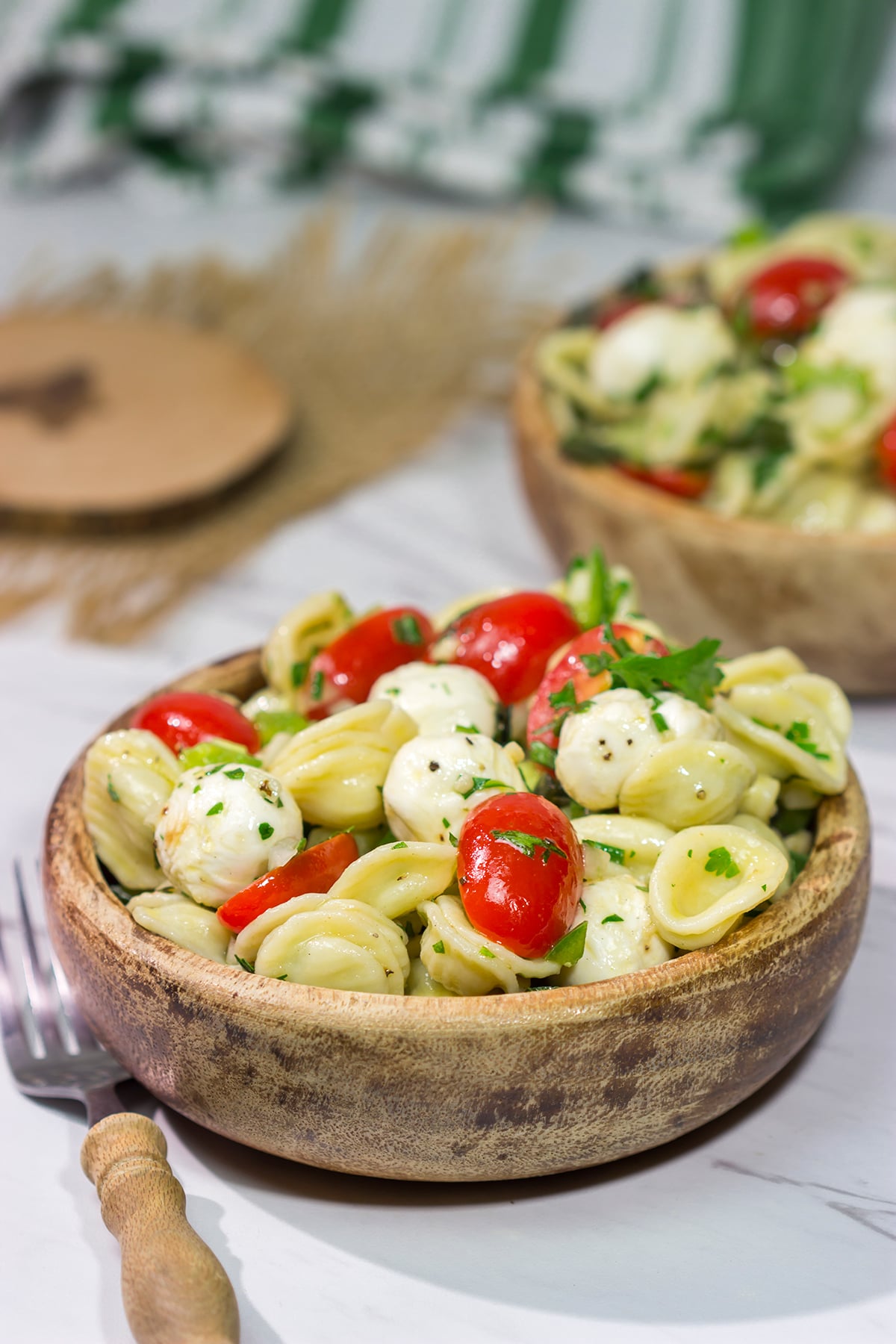 Traditional Caprese salad...in pasta salad form! This Caprese Pasta Salad is filled with fresh mozzarella, tomatoes and basil. It's a great summer side dish!