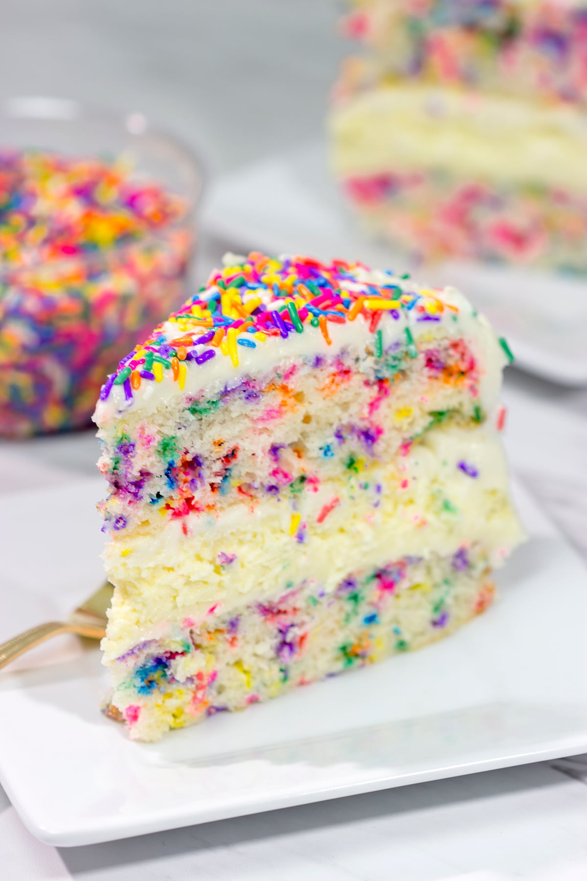 Everything's better with sprinkles! This Funfetti Cheesecake Cake features a layer of cheesecake in between two layers of white cake...and lots of sprinkles! It's a fun cake for any sort of celebration.