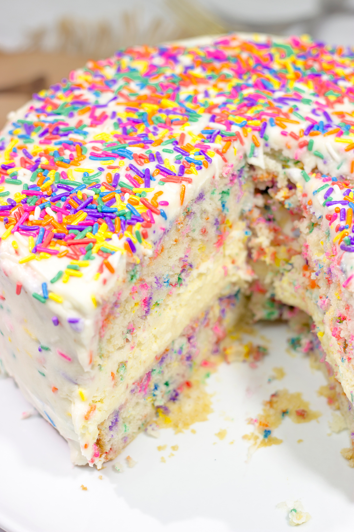 Everything's better with sprinkles! This Funfetti Cheesecake Cake features a layer of cheesecake in between two layers of white cake...and lots of sprinkles! It's a fun cake for any sort of celebration.
