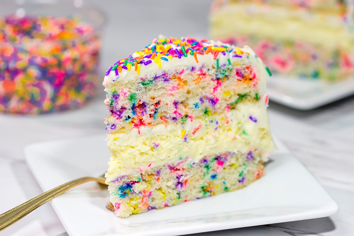 Everything's better with sprinkles! This Funfetti Cheesecake Cake features a layer of cheesecake in between two layers of white cake...and lots of sprinkles! It's a fun cake for any sort of celebration.