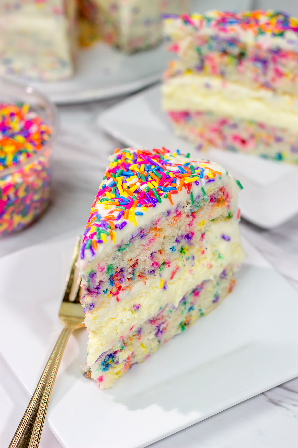 Everything's better with sprinkles! This Funfetti Cheesecake Cake features a layer of cheesecake in between two layers of white cake...and lots of sprinkles! It's a fun cake for any sort of celebration.