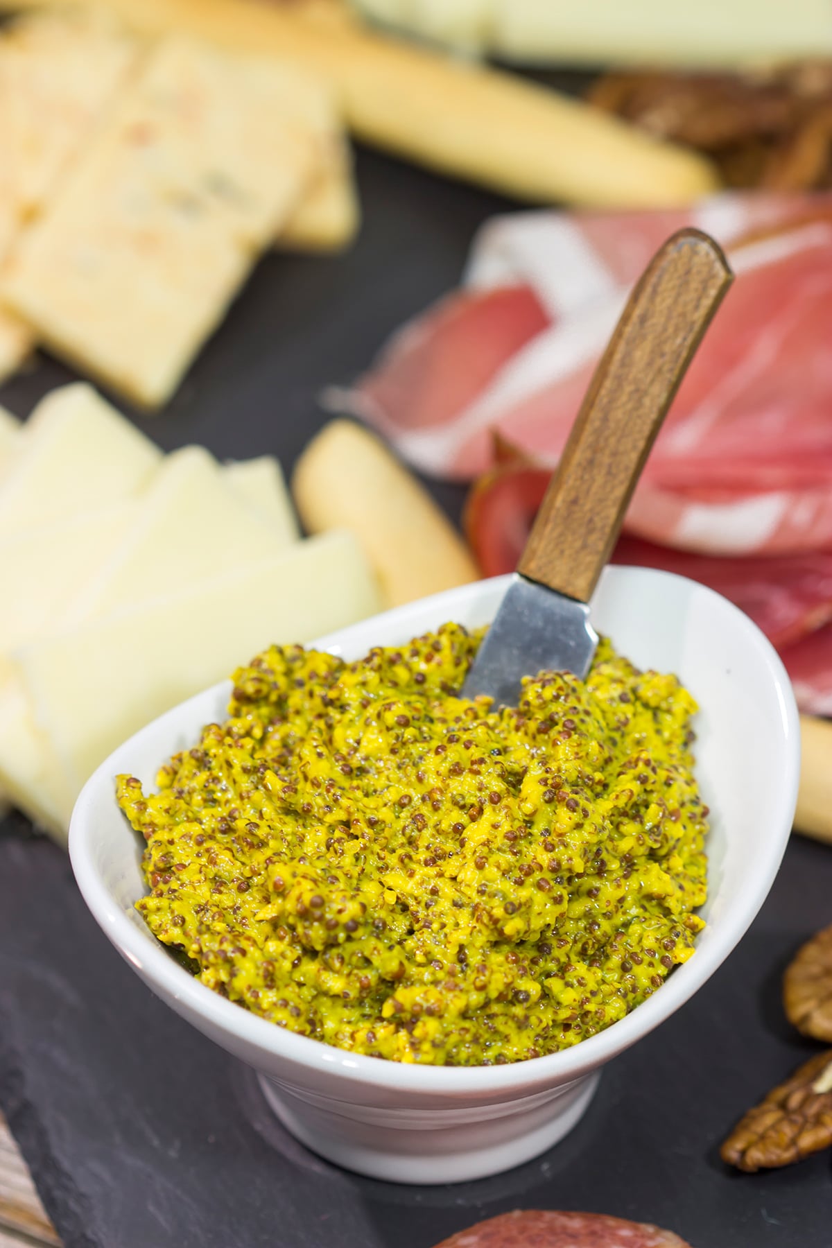 Looking for a fun appetizer idea? Make a batch of this Homemade Stoneground Mustard and whip up a cheddar cheese charcuterie board!