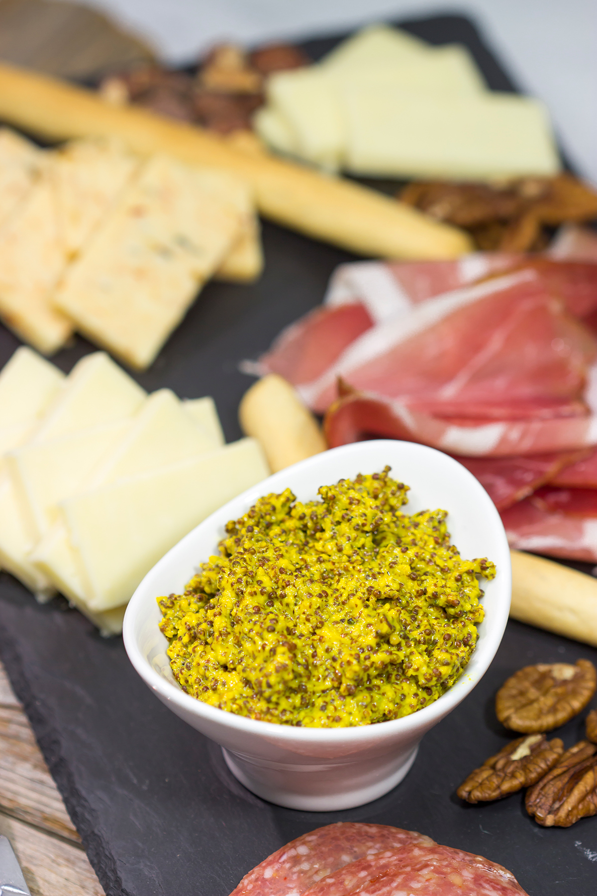 Looking for a fun appetizer idea? Make a batch of this Homemade Stoneground Mustard and whip up a cheddar cheese charcuterie board!