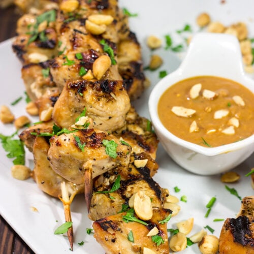 These Thai Chicken Skewers are flavor-packed and easy...perfect for summer grilling in the backyard! Serve 'em up with an Easy Peanut Sauce for maximum taste!