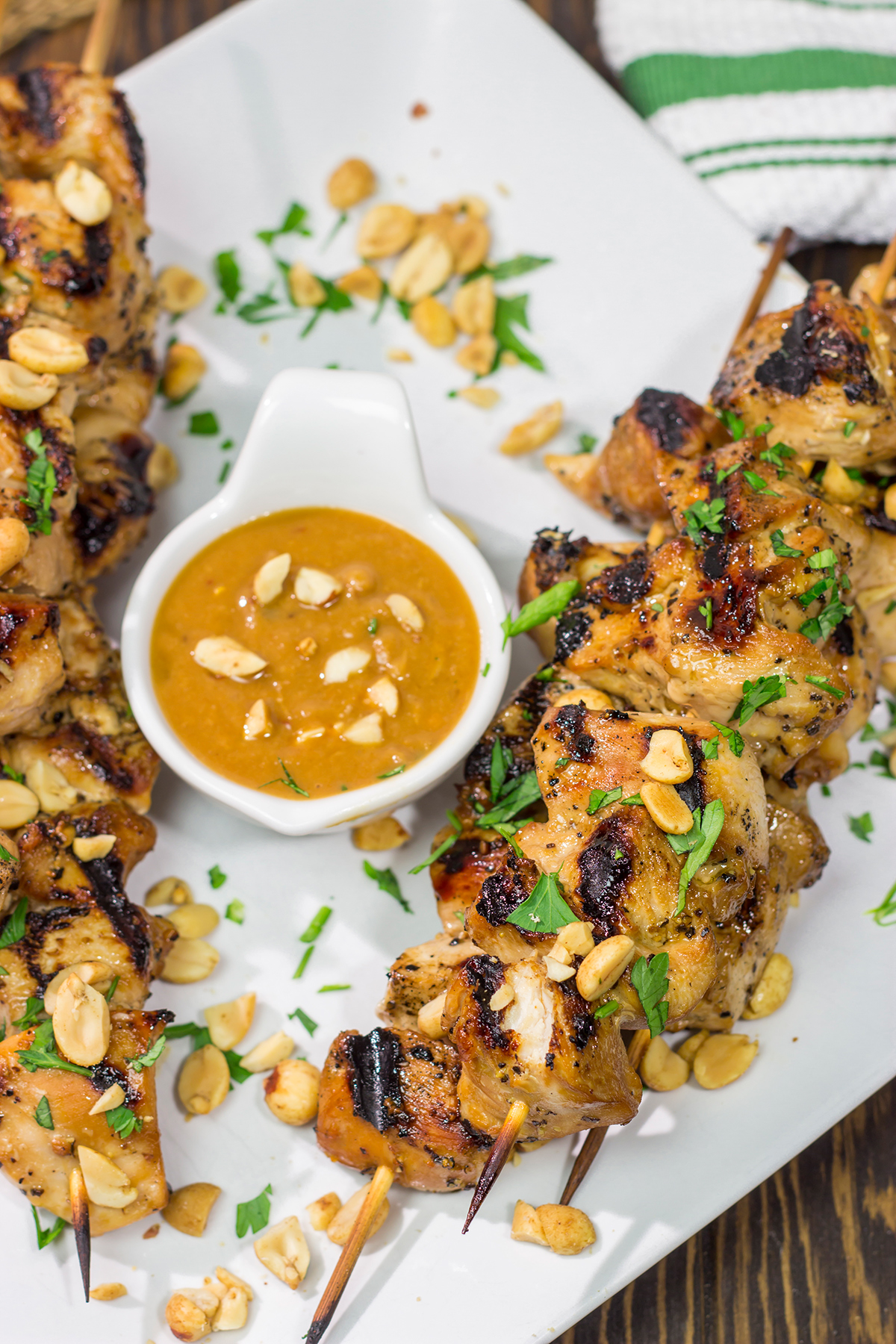 These Thai Chicken Skewers are flavor-packed and easy...perfect for summer grilling in the backyard! Serve 'em up with an Easy Peanut Sauce for maximum taste!