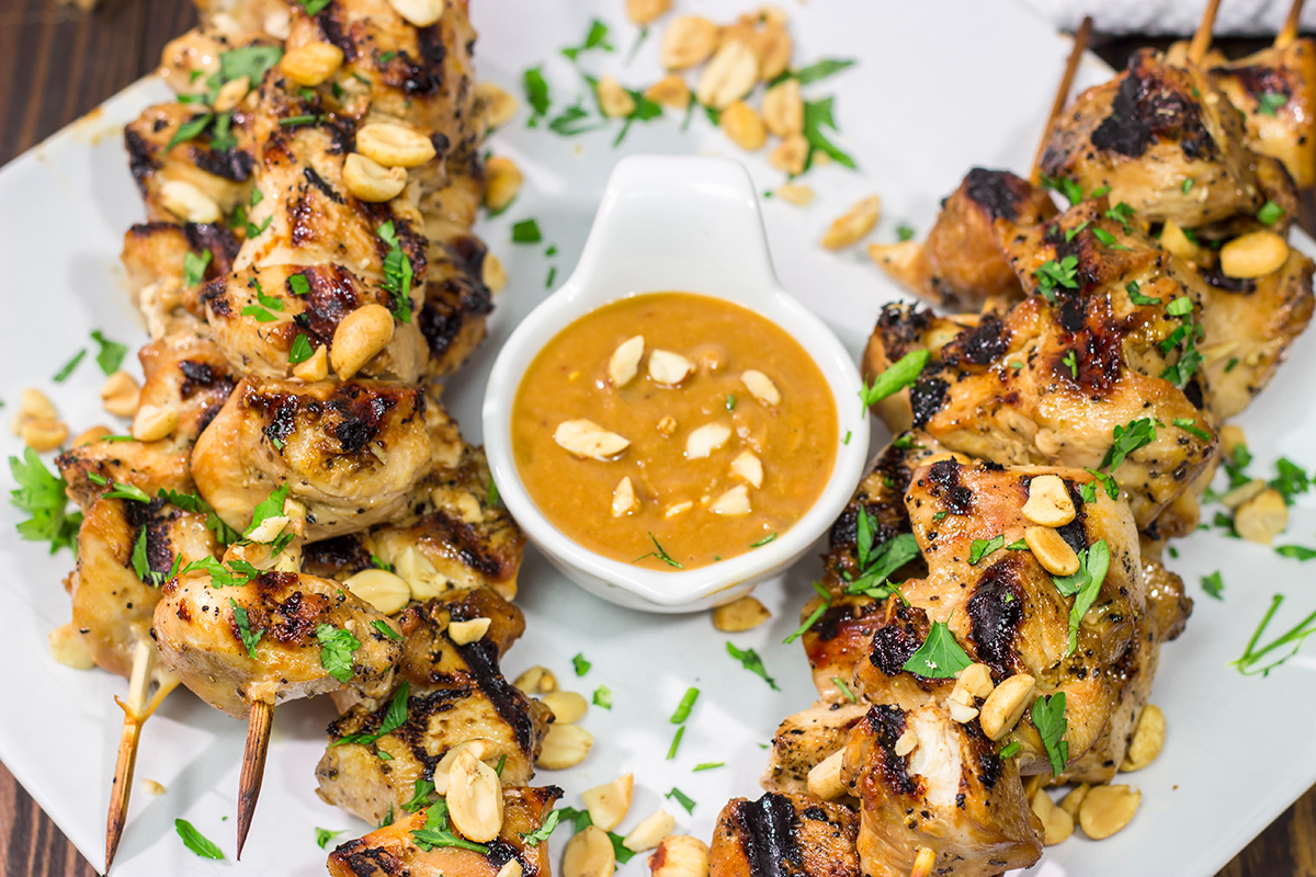 These Thai Chicken Skewers are flavor-packed and easy...perfect for summer grilling in the backyard! Serve 'em up with an Easy Peanut Sauce for maximum taste!
