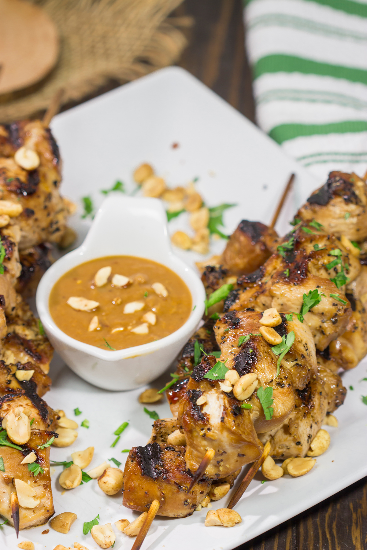 These Thai Chicken Skewers are flavor-packed and easy...perfect for summer grilling in the backyard! Serve 'em up with an Easy Peanut Sauce for maximum taste!