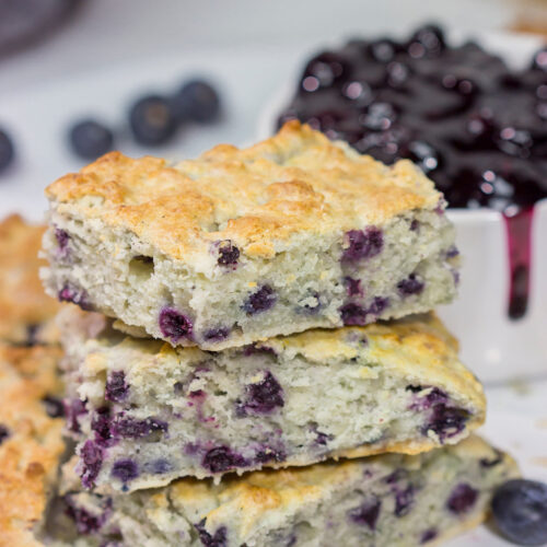 These Blueberry Cream Biscuits are served with blueberry sauce for maximum berry flavor. This easy recipe is great for summer weekend breakfasts!