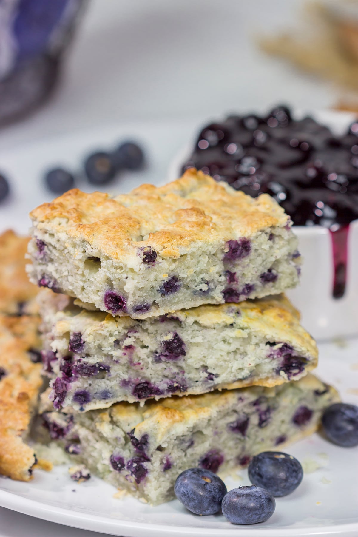 These Blueberry Cream Biscuits are served with blueberry sauce for maximum berry flavor. This easy recipe is great for summer weekend breakfasts!
