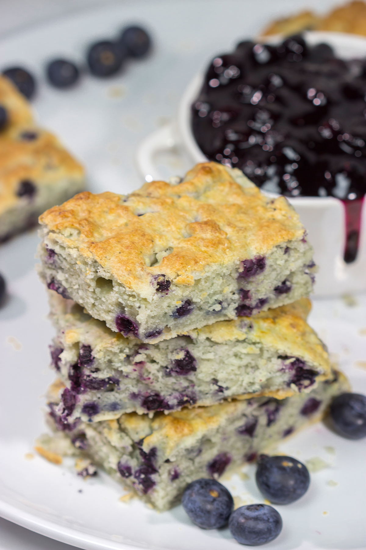 These Blueberry Cream Biscuits are served with blueberry sauce for maximum berry flavor. This easy recipe is great for summer weekend breakfasts!