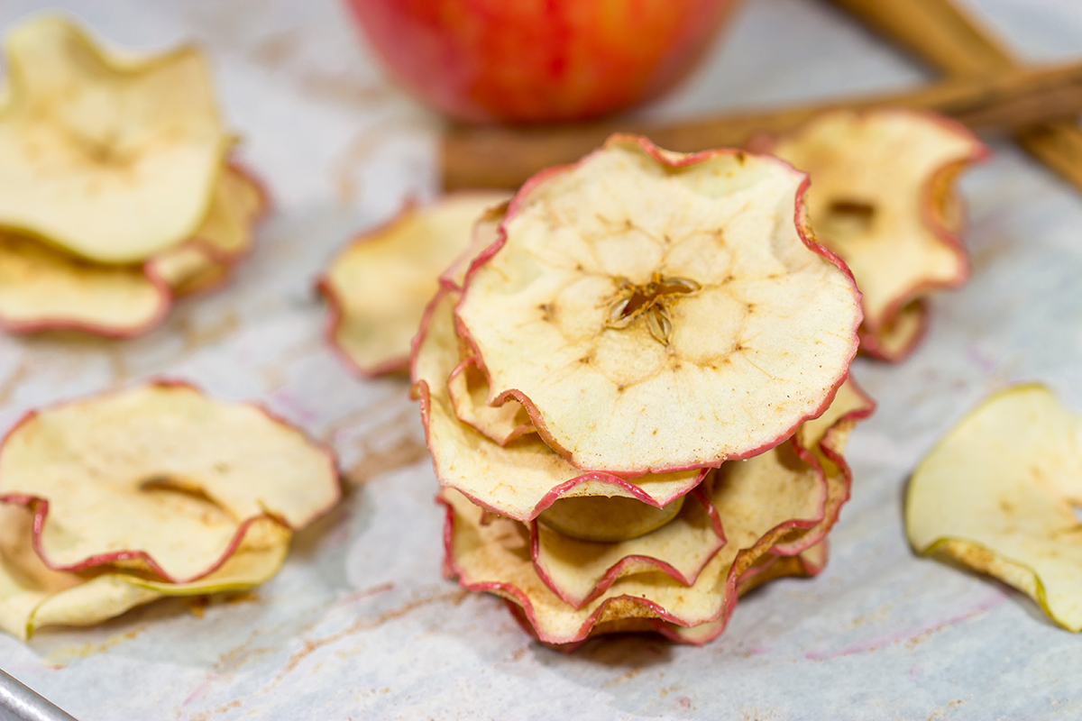 Lightly dusted with cinnamon and sugar, these Oven Baked Cinnamon Apple Chips are an easy (and healthy!) snack. Bake up a batch today!