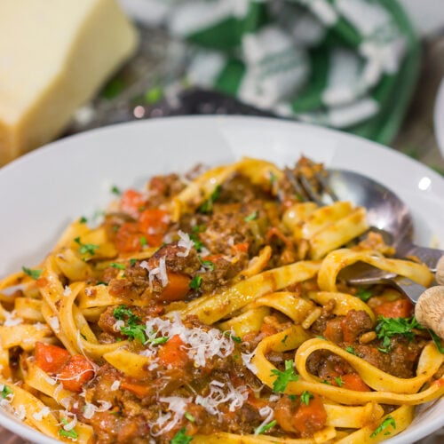 Tagliatelle Bolognese features a slow-cooked meat sauce served over ribbons of pasta. This recipe is classic Italian comfort food at its best!