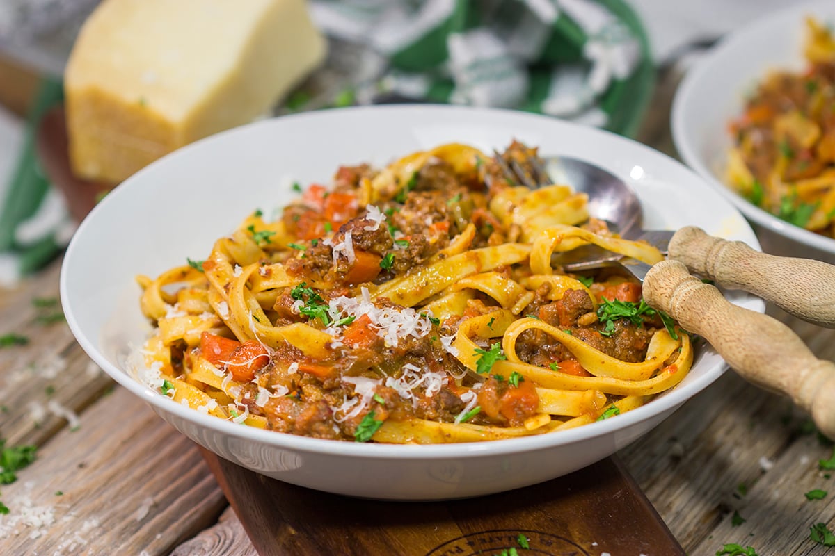 agliatelle Bolognese features a slow-cooked meat sauce served over ribbons of pasta. This recipe is classic Italian comfort food at its best!