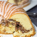 This Cinnamon Pecan Pound Cake features a sour cream pound cake filled with a layer of sugared pecans - it's one heck of a tasty dessert!