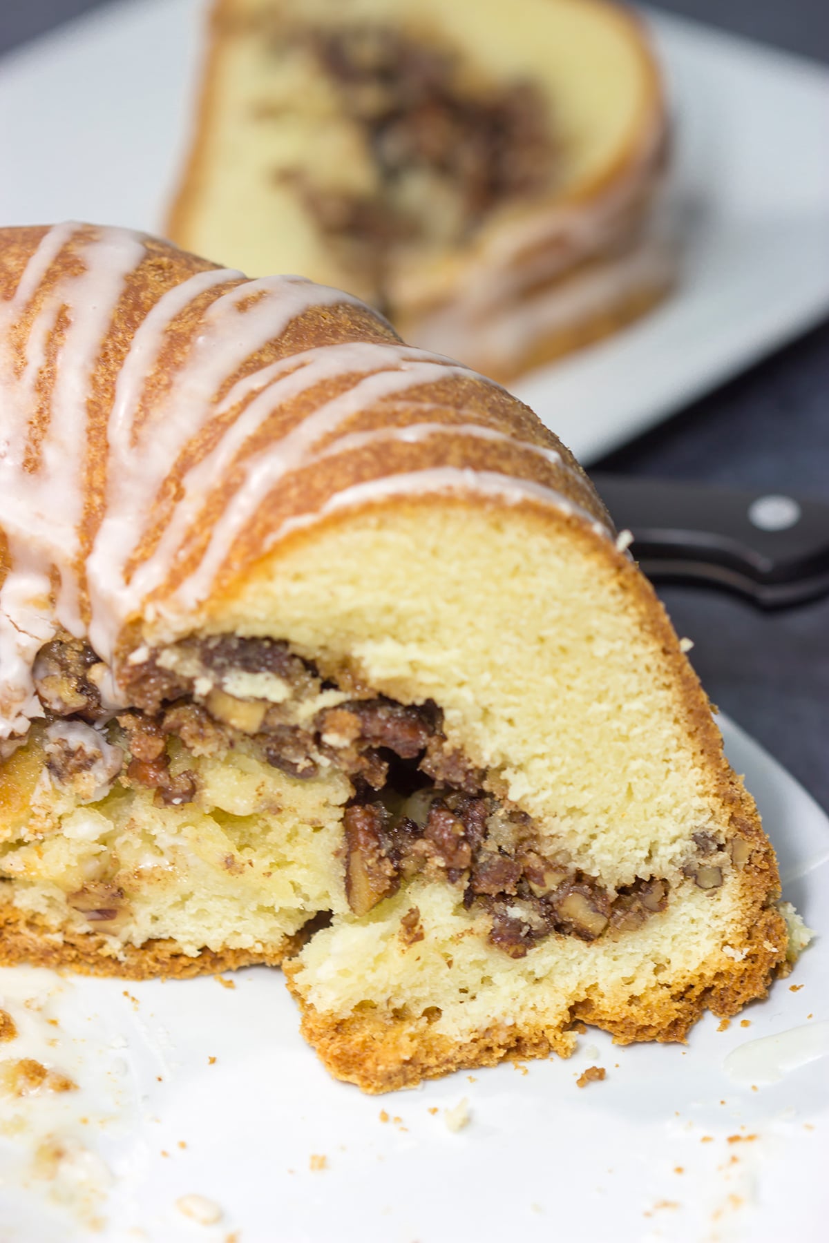 This Cinnamon Pecan Pound Cake features a sour cream pound cake filled with a layer of sugared pecans - it's one heck of a tasty dessert!