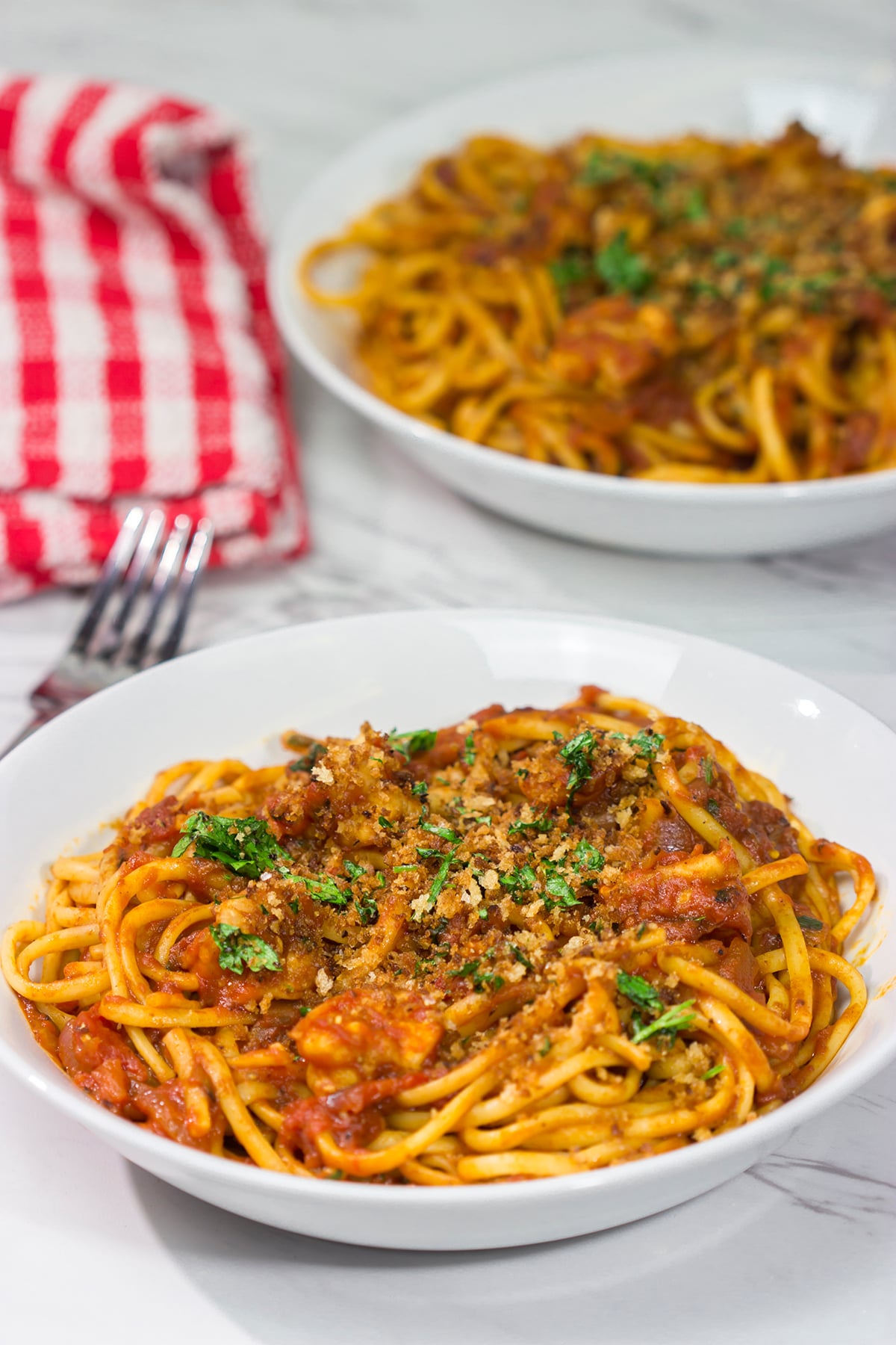 Featuring succulent shrimp tossed with linguine and a spicy red sauce, Shrimp Fra Diavolo is a delicious recipe next time you're craving pasta!