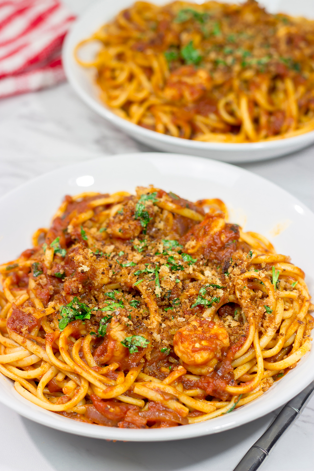Featuring succulent shrimp tossed with linguine and a spicy red sauce, Shrimp Fra Diavolo is a delicious recipe next time you're craving pasta!