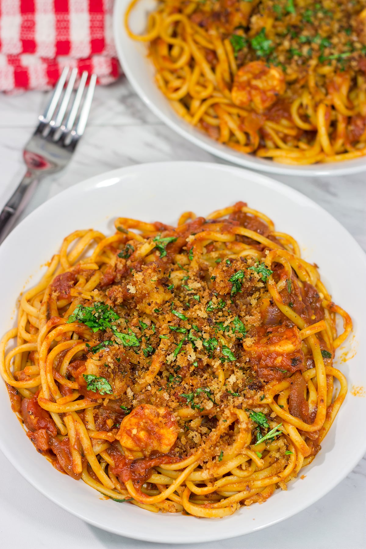 Featuring succulent shrimp tossed with linguine and a spicy red sauce, Shrimp Fra Diavolo is a delicious recipe next time you're craving pasta!