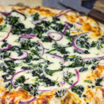 Mix up pizza night with this Spinach Ricotta Pizza! Using ricotta cheese for "sauce," this pizza is extra creamy...and extra delicious!