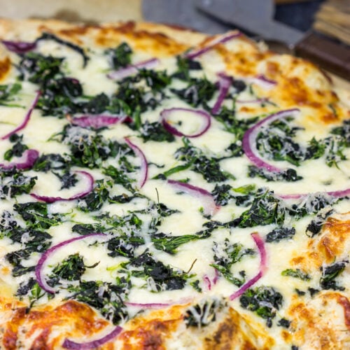 Mix up pizza night with this Spinach Ricotta Pizza! Using ricotta cheese for "sauce," this pizza is extra creamy...and extra delicious!