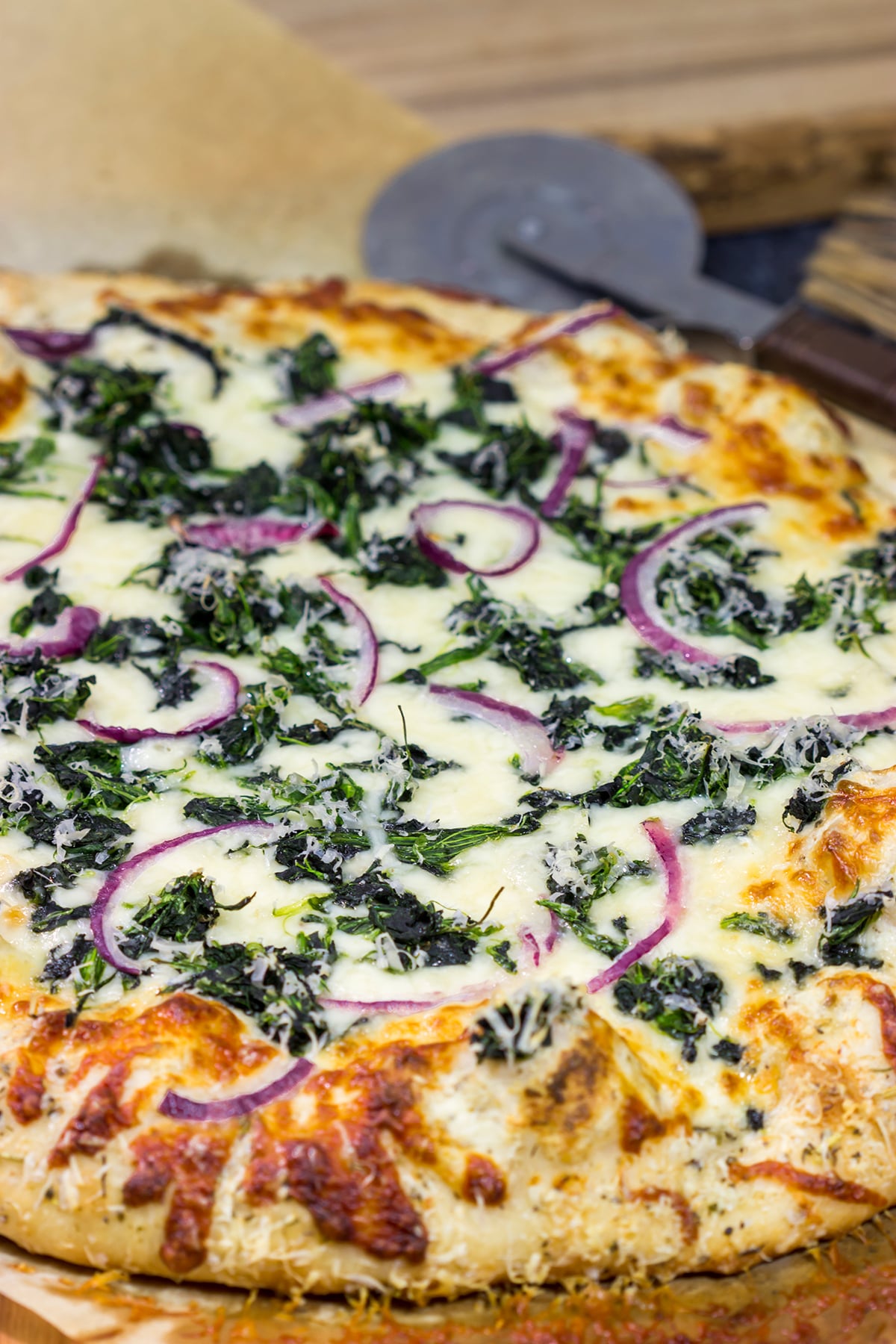 Mix up pizza night with this Spinach Ricotta Pizza! Using ricotta cheese for "sauce," this pizza is extra creamy...and extra delicious!