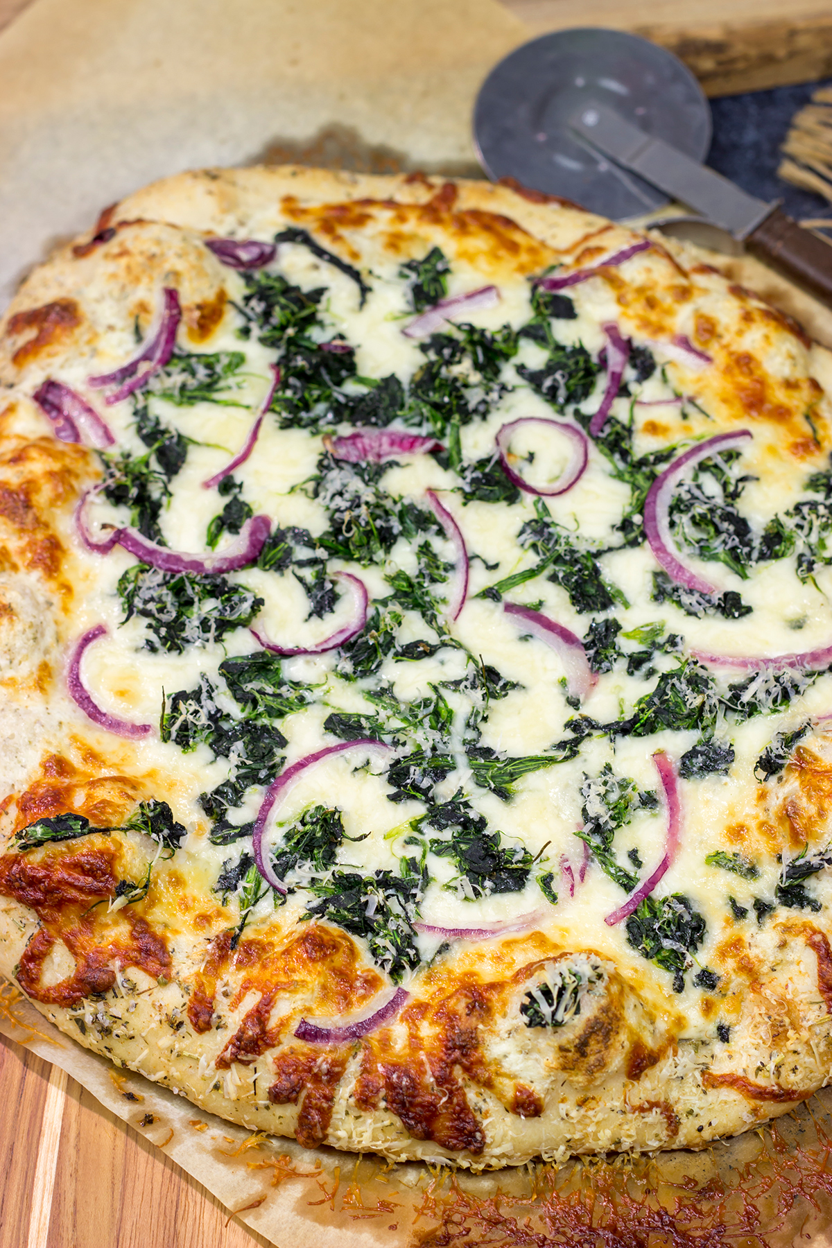 Mix up pizza night with this Spinach Ricotta Pizza! Using ricotta cheese for "sauce," this pizza is extra creamy...and extra delicious!