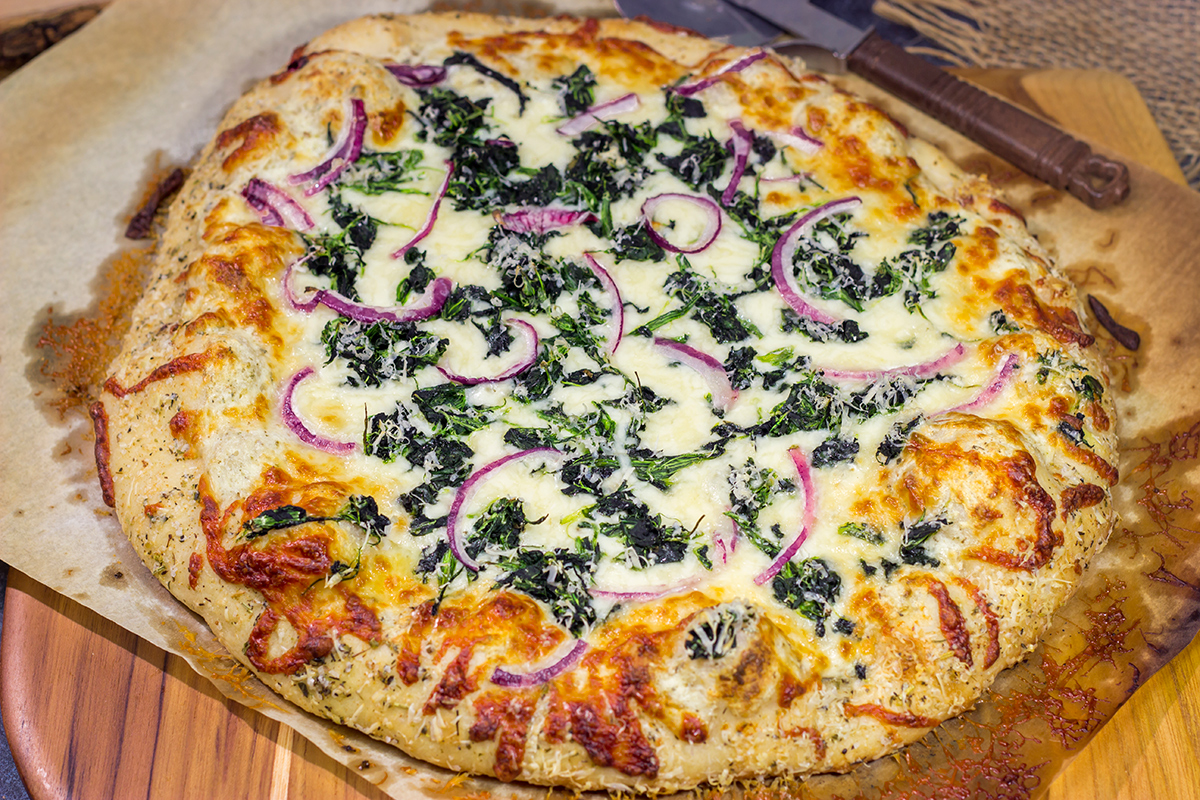Mix up pizza night with this Spinach Ricotta Pizza! Using ricotta cheese for "sauce," this pizza is extra creamy...and extra delicious!