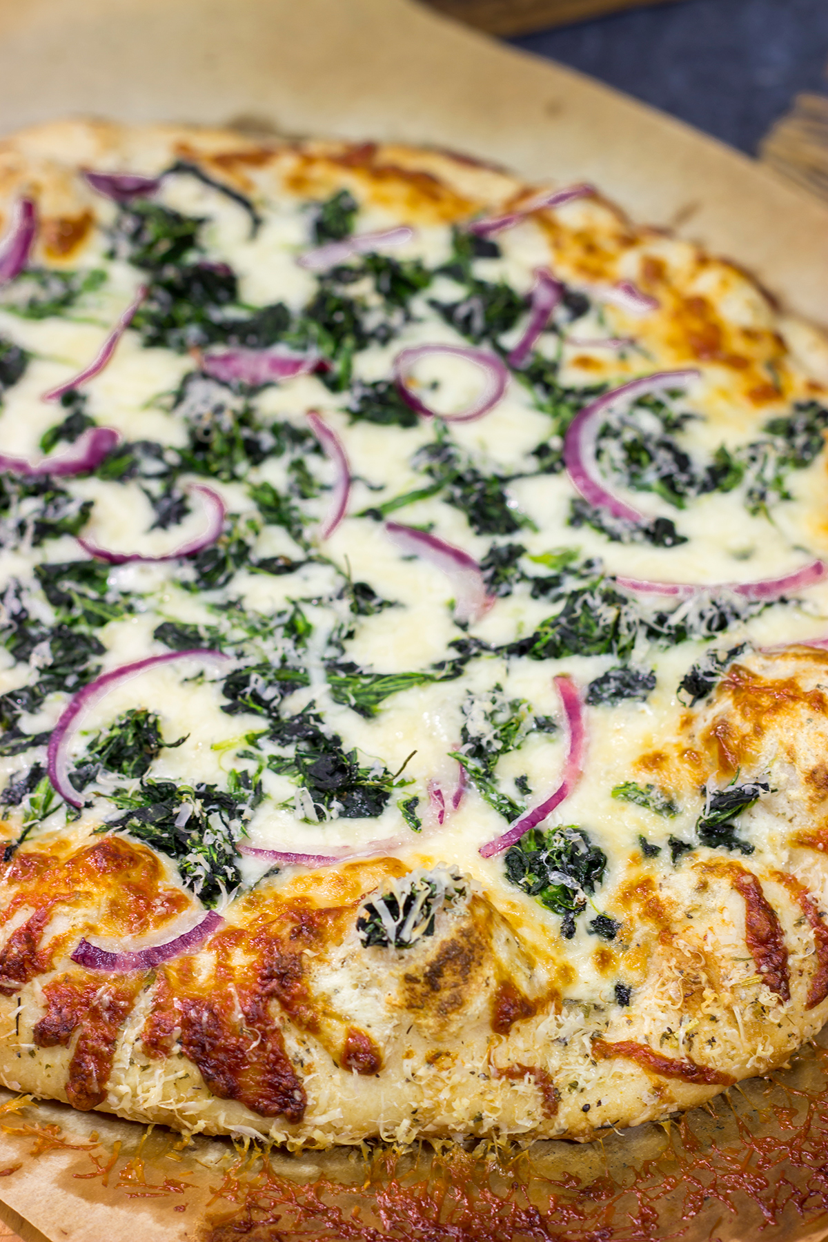 Mix up pizza night with this Spinach Ricotta Pizza! Using ricotta cheese for "sauce," this pizza is extra creamy...and extra delicious!