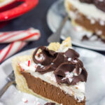 Topped with creamy whipped cream and large chocolate curls, this Chocolate Peppermint Pie is a tasty and impressive dessert to serve during the holiday season!