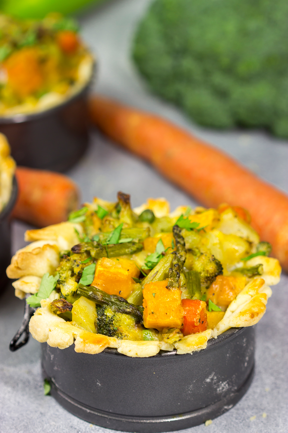 Tired of the same old vegetables as a side dish? Put 'em in a pot pie! Packed with an assortment of roasted veggies, this Roasted Veggie Pot Pie is a unique and tasty dinner recipe!