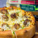Pull out the springform pan...for pizza! Filled with 2 types of cheese, meatballs and seasonings, this Deep Dish Meatball Pizza is a fun way to mix up pizza night!
