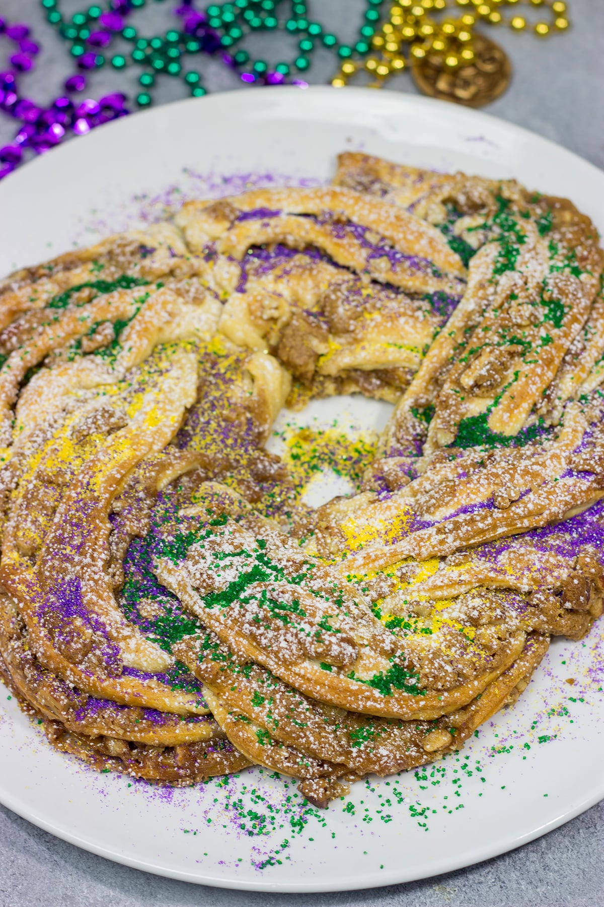 This Easy King Cake uses refrigerated crescent dough instead of the traditional yeasted dough. It's an easy - and delicious - way to celebrate Mardi Gras!