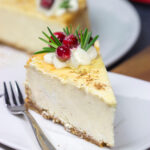 Topped with sugared cranberries and eggnog whipped cream, this Eggnog Cheesecake is a festive way to celebrate the holiday season!