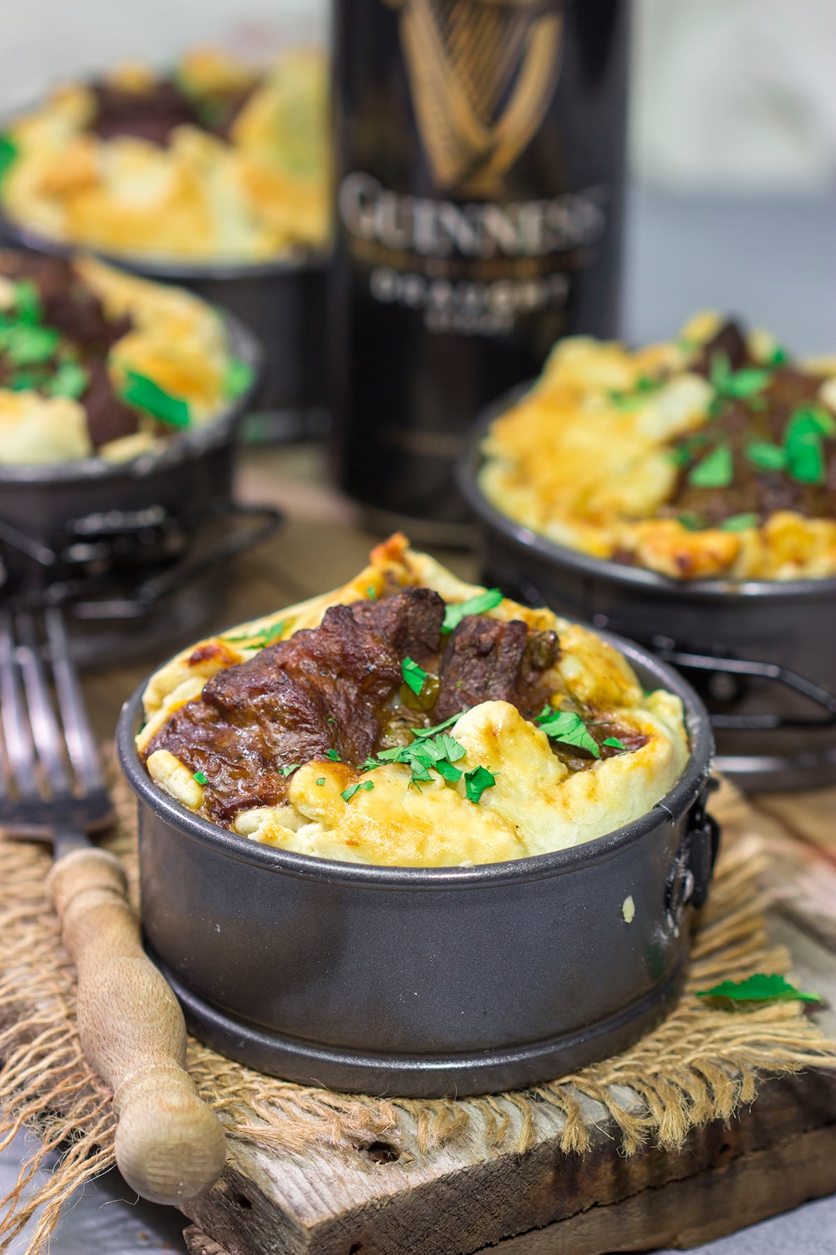 Featuring a flaky pie crust filled with chunks of beef simmered in stout beer, these Individual Beef and Guinness Pot Pies are a tasty winter comfort food!