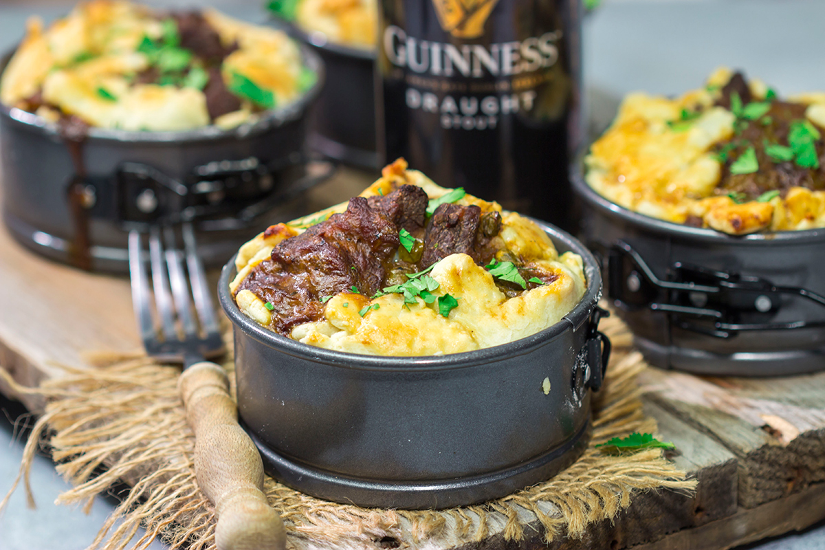 Featuring a flaky pie crust filled with chunks of beef simmered in stout beer, these Individual Beef and Guinness Pot Pies are a tasty winter comfort food!