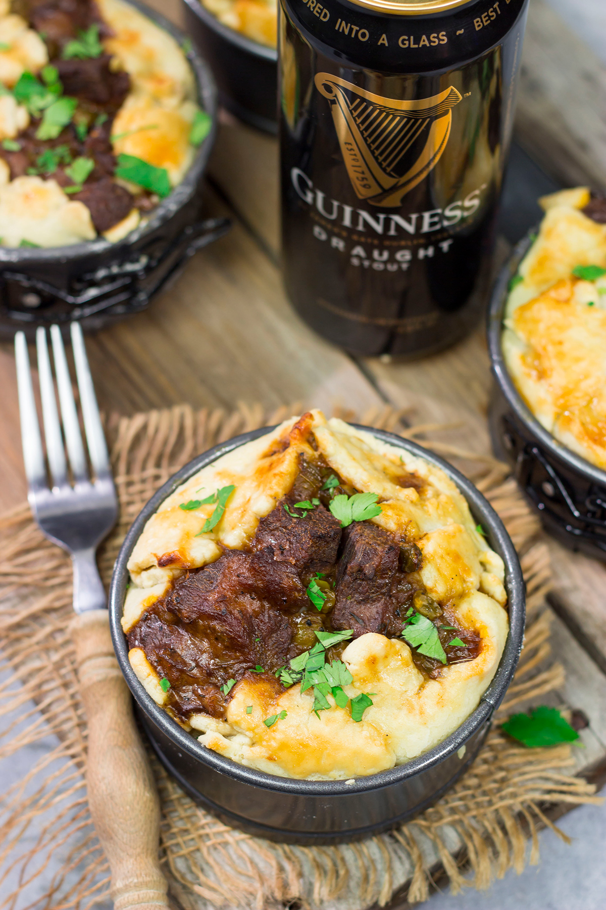 Featuring a flaky pie crust filled with chunks of beef simmered in stout beer, these Individual Beef and Guinness Pot Pies are a tasty winter comfort food!