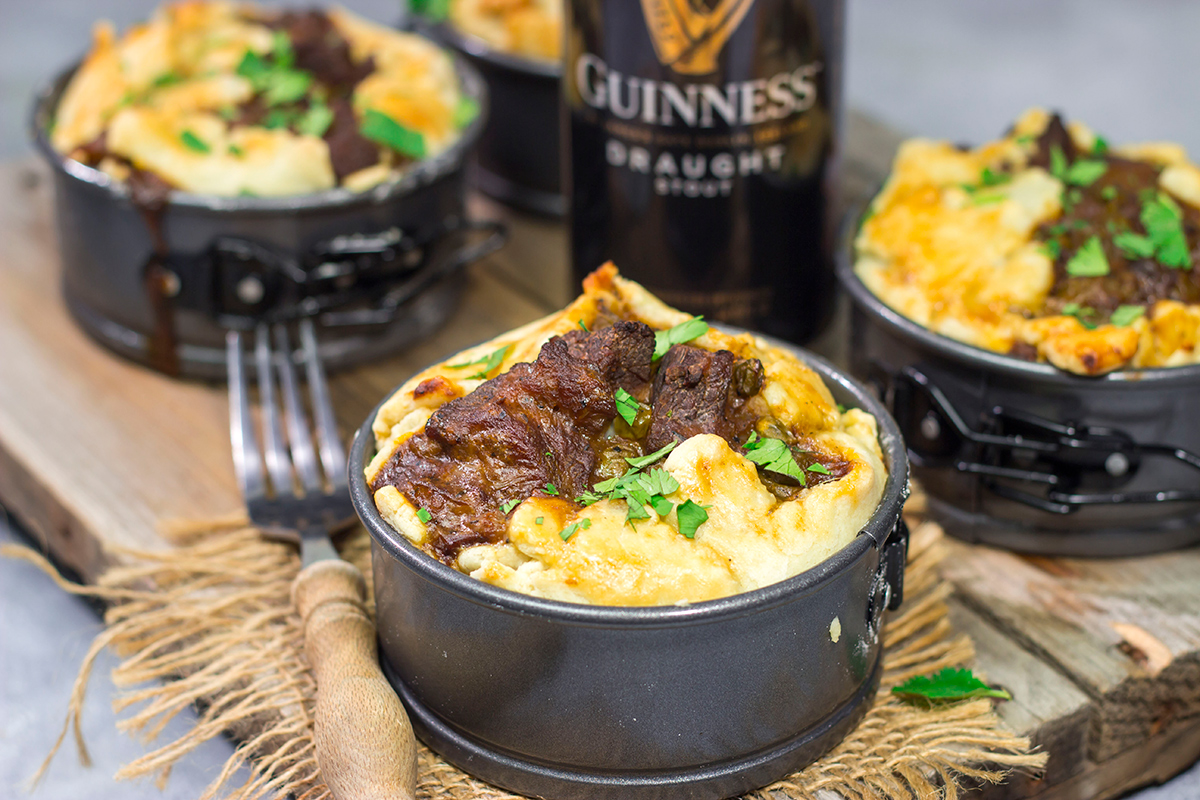 Featuring a flaky pie crust filled with chunks of beef simmered in stout beer, these Individual Beef and Guinness Pot Pies are a tasty winter comfort food!