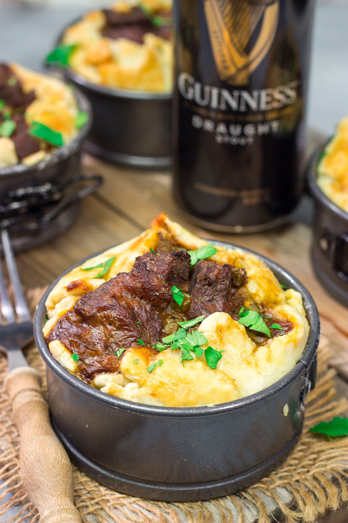 Featuring a flaky pie crust filled with chunks of beef simmered in stout beer, these Individual Beef and Guinness Pot Pies are a tasty winter comfort food!