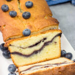 Featuring a ribbon of blueberry sauce swirled into the cake, this Blueberry Cream Cheese Pound Cake is a fun and tasty treat! Bake one today!