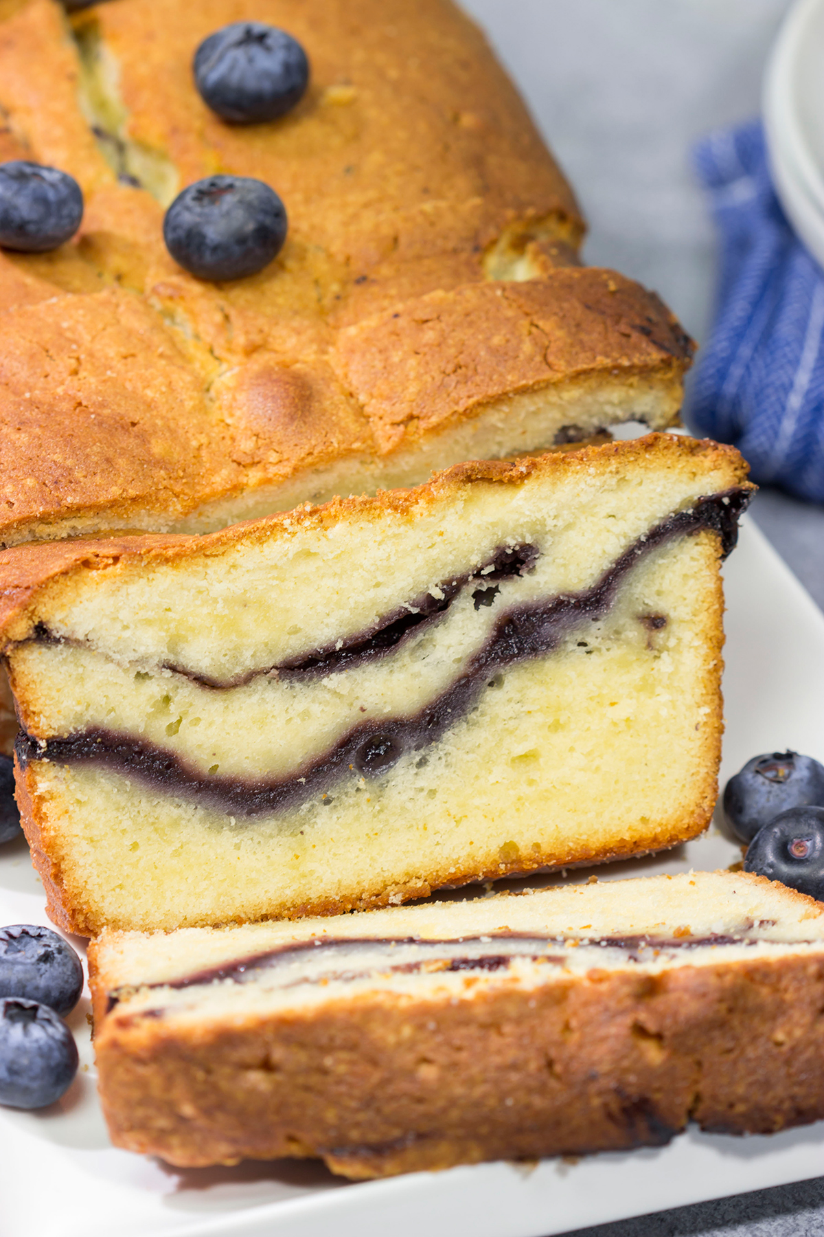 Featuring a ribbon of blueberry sauce swirled into the cake, this Blueberry Cream Cheese Pound Cake is a fun and tasty treat! Bake one today!