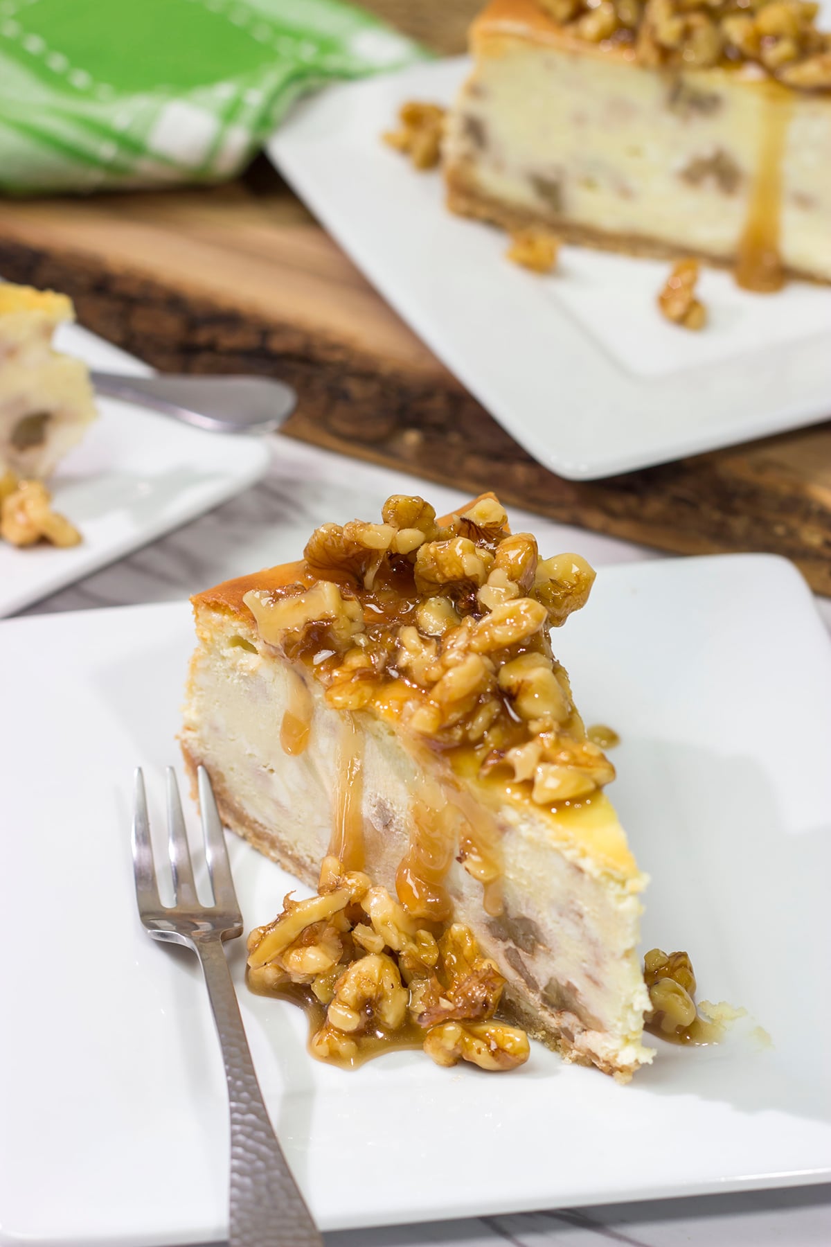 Featuring a warm honey walnut topping on top of a classic cheesecake, a slice of this Honey Walnut Cheesecake is a great way to end the day!