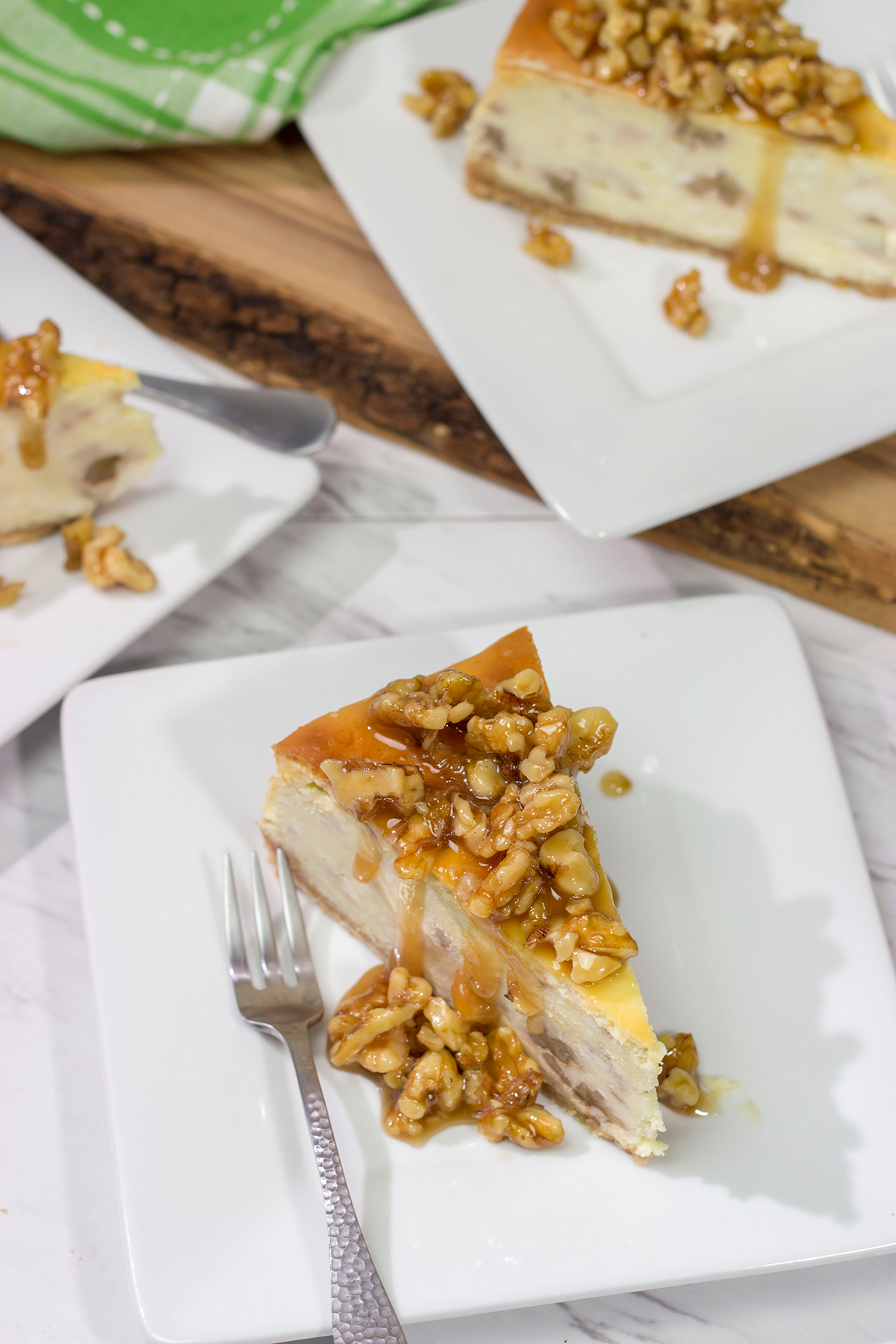 Featuring a warm honey walnut topping on top of a classic cheesecake, a slice of this Honey Walnut Cheesecake is a great way to end the day!