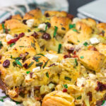 Put a fun spin on monkey bread with this Mediterranean Pull Apart Bread! Think melty cheese, bread, olives, artichokes and sun-dried tomatoes - yum!