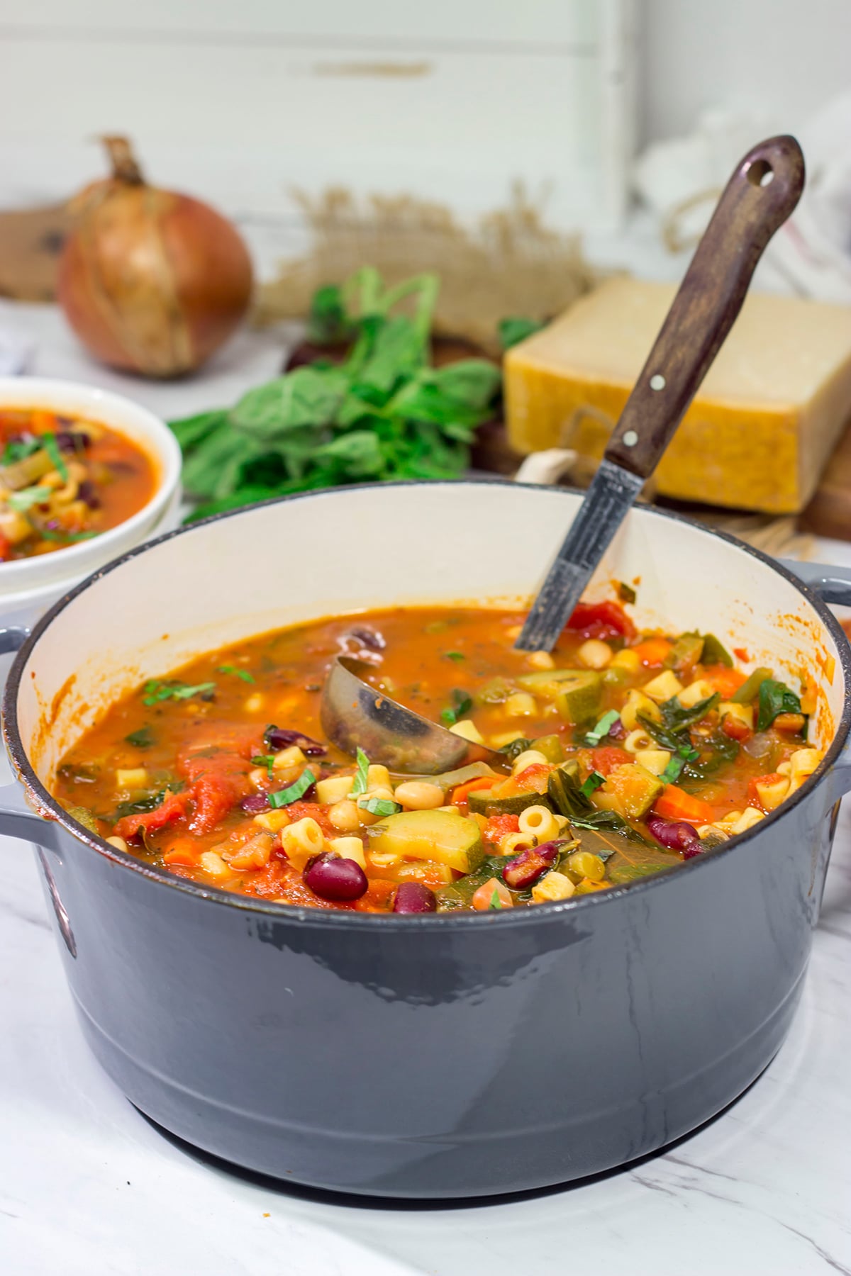 Minestrone Soup is an example of rustic Italian comfort food at its best! Serve this vegetable soup with Italian bread for an easy winter meal!
