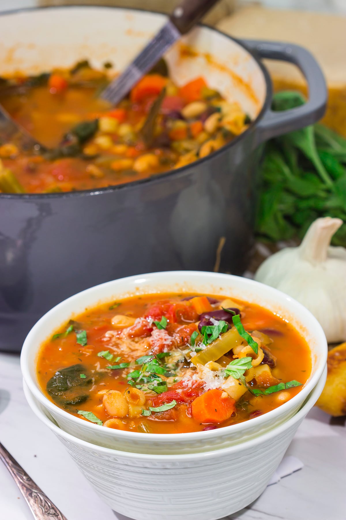 Minestrone Soup is an example of rustic Italian comfort food at its best! Serve this vegetable soup with Italian bread for an easy winter meal!